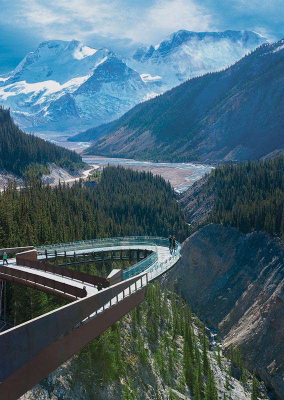 View of the Columbia Icefield Skywalk platform jutting out above valley with glacier views