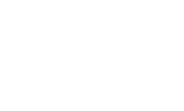 Glacier View Lodge guest lounge with fireplace and floor to ceiling view of the Columbia Icefield