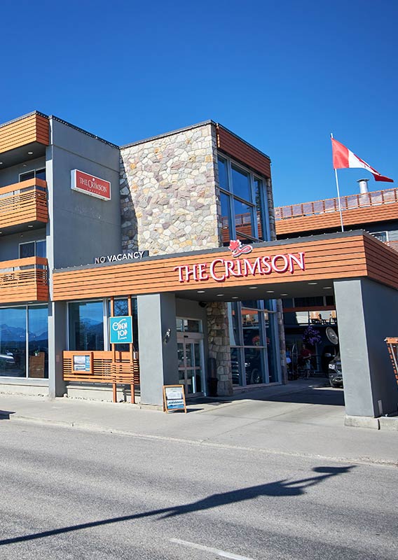 Exterior of The Crimson in summer with a sunny sky.