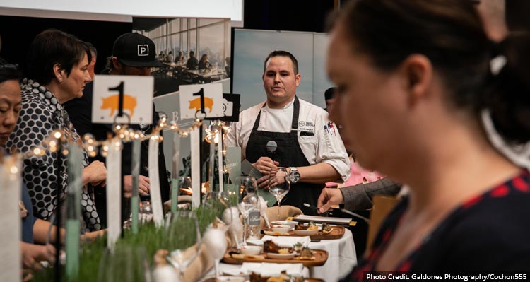 Chef Scott at his table of dishes at Cochon555
