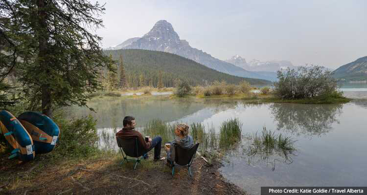 Two people camping at Waterfowl Lake Campground
